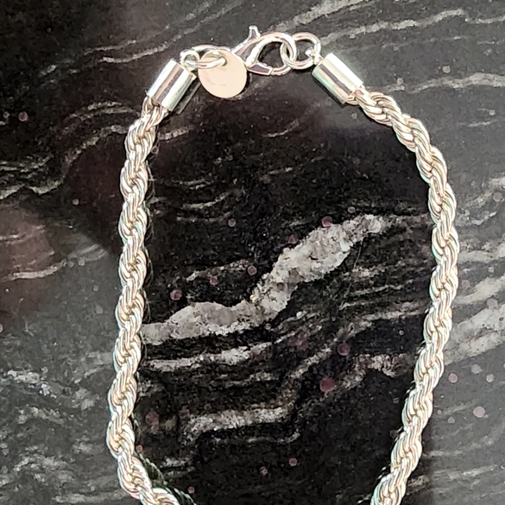 Twisted rope silver bracelet-  Stamped 925.  Great Addition To Your Collection!